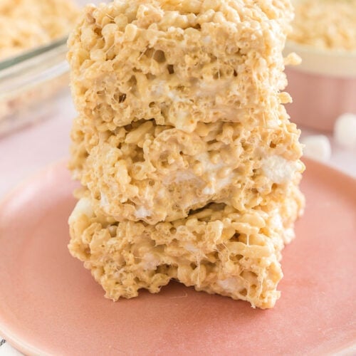 Three salted caramel rice krispie treats on a plate