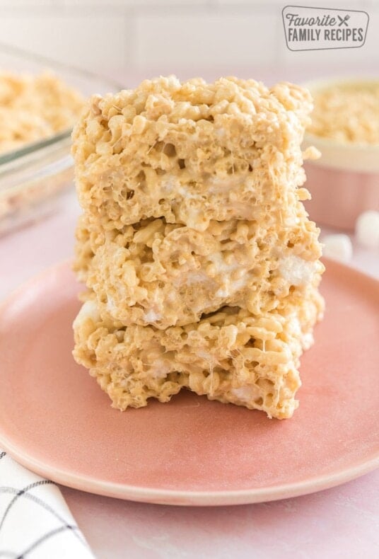 Three salted caramel rice krispie treats on a plate