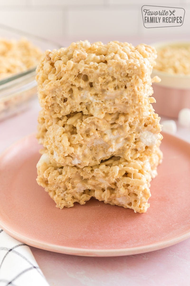 Three salted caramel rice krispie treats on a plate