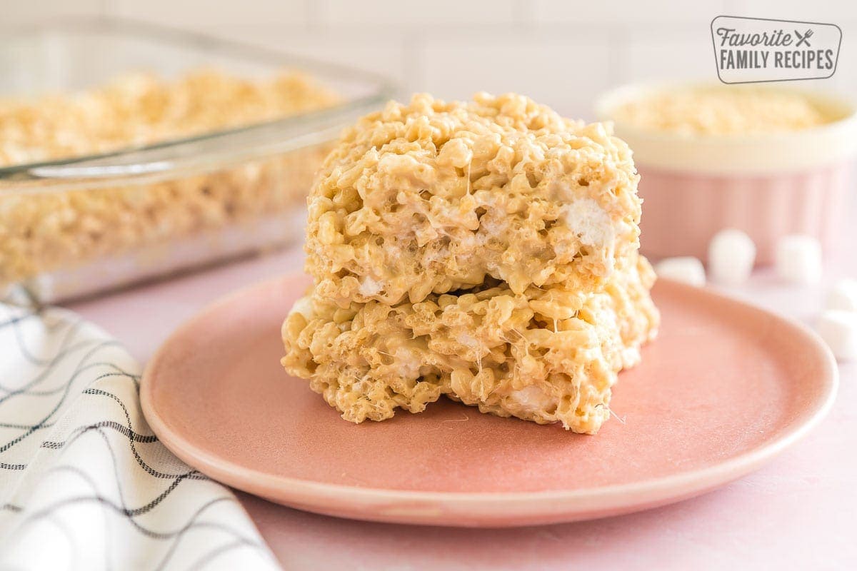 Two salted caramel rice krispie treats on a plate.