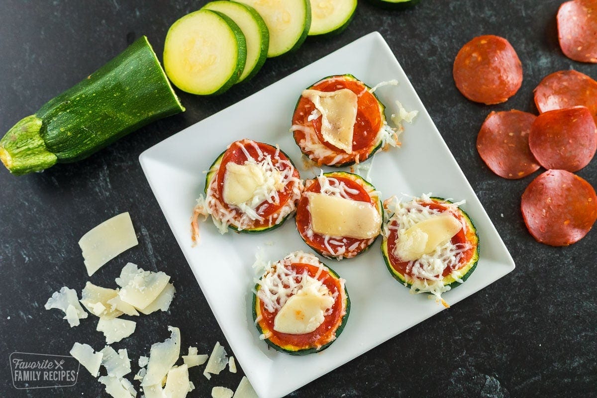 Sliced zucchini copped with pizza sauce, pepperoni, and cheese and cooked in the air fryer