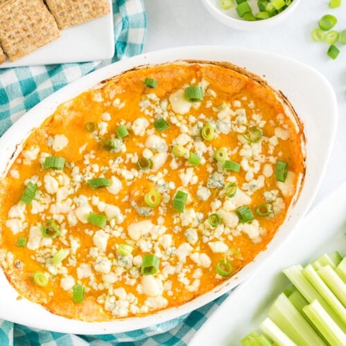 An oval baking dish full of buffalo chicken dip