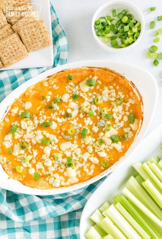 An oval baking dish full of buffalo chicken dip