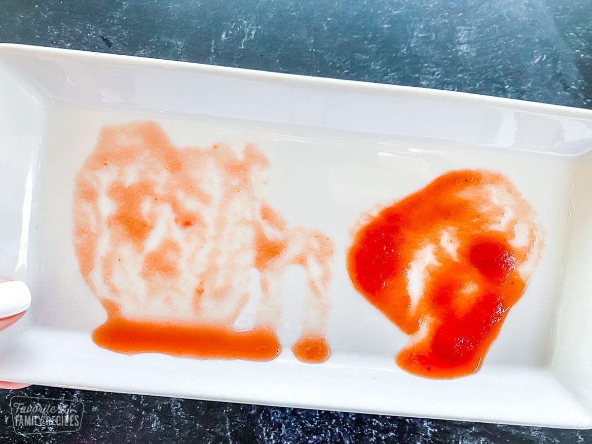 A plate with two kinds of sauce, one more clear and runny and the other thick