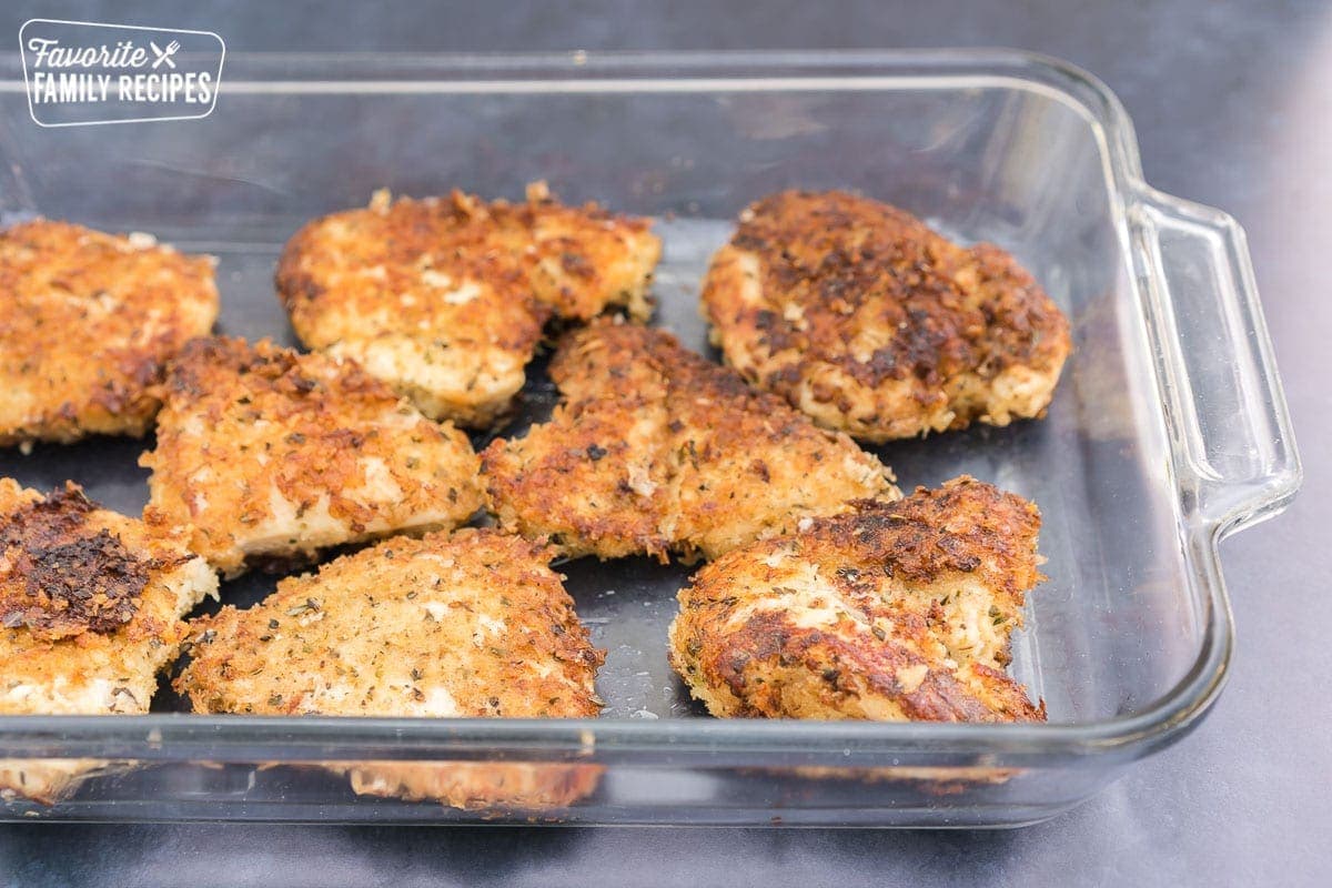 Parmesan crusted chicken breasts in a glass baking dish