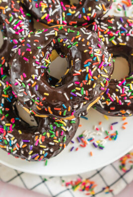 A platter of Air Fryer Donuts topped with chocolate icing and sprinkles