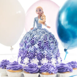 A cake made from an Elsa Barbie Doll.