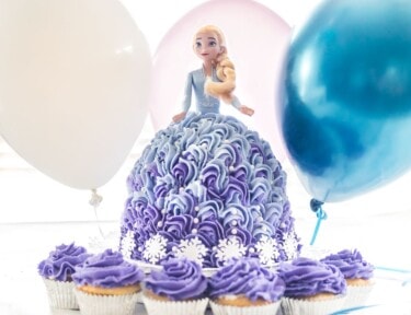 A cake made from an Elsa Barbie Doll