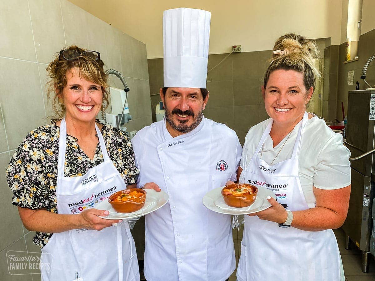 This potato gnocchi recipe has become a new family favorite. Discover, as we did in Italy, how easy and delicious making homemade gnocchi can be. Echo, Erica, and Chef Carlo Ricci holding gnocchi.