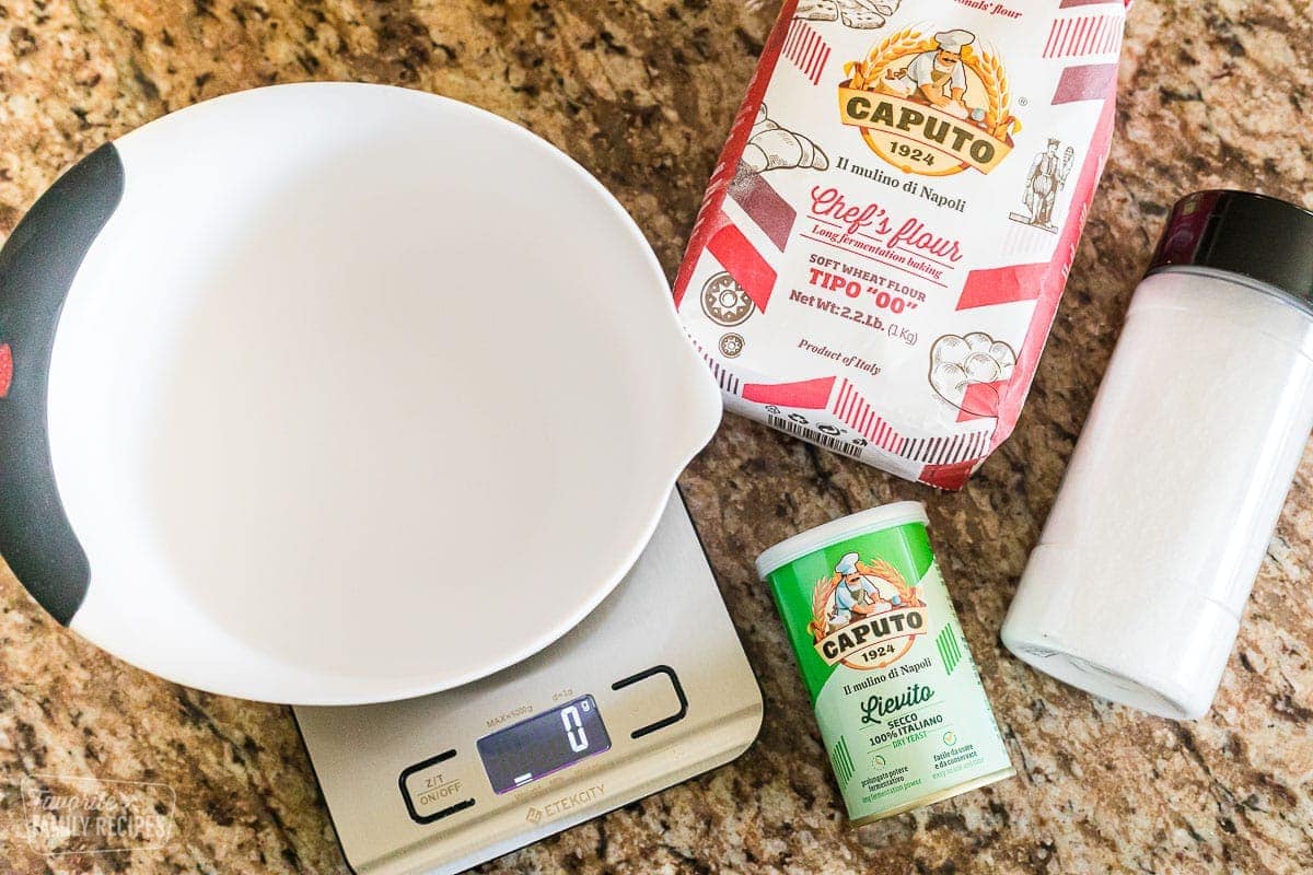 Ingredients to make pizza dough. Caputo flour, yeast, and salt.