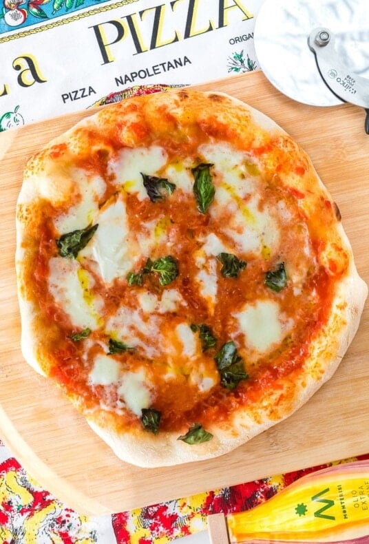 A Neapolitan pizza with tomato sauce, buffalo mozzarella, and fresh basil