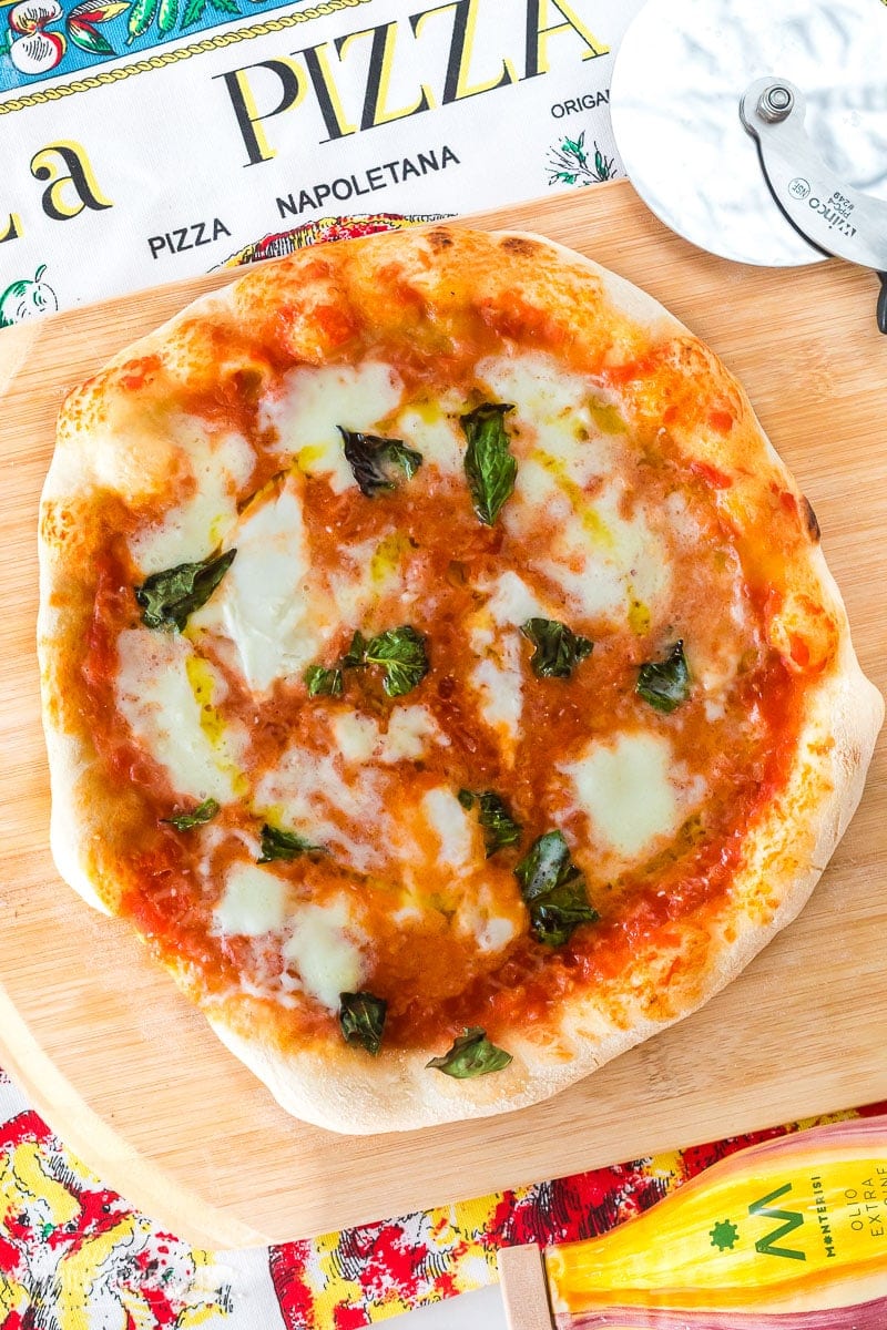 A Neapolitan pizza with tomato sauce, buffalo mozzarella, and fresh basil