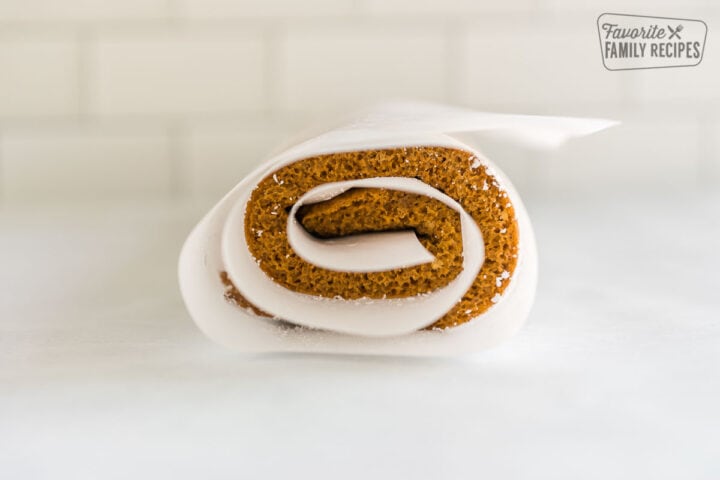 Pumpkin cake rolled up in parchment paper