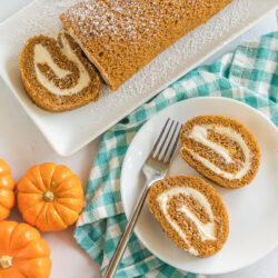 Two slices of pumpkin roll on a plate