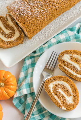 Two slices of pumpkin roll on a plate