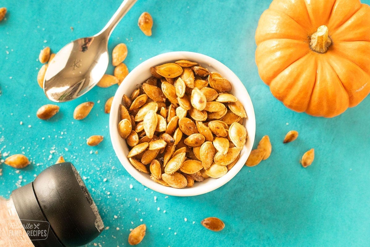 Roasted pumpkin seeds in a bowl.