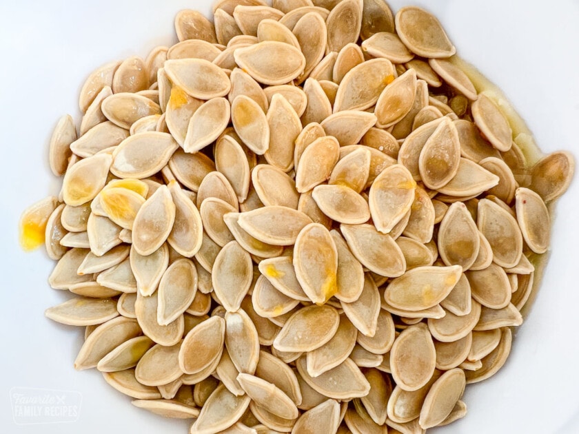 Uncooked pumpkin seeds in a bowl