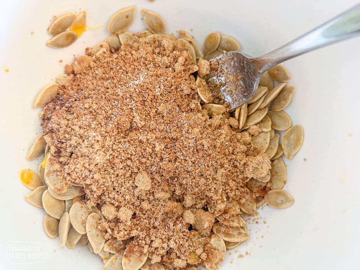 Sweet and spicy mixture on top of pumpkin seeds in a bowl