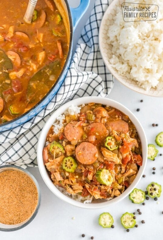 A bowl of gumbo on top of rice