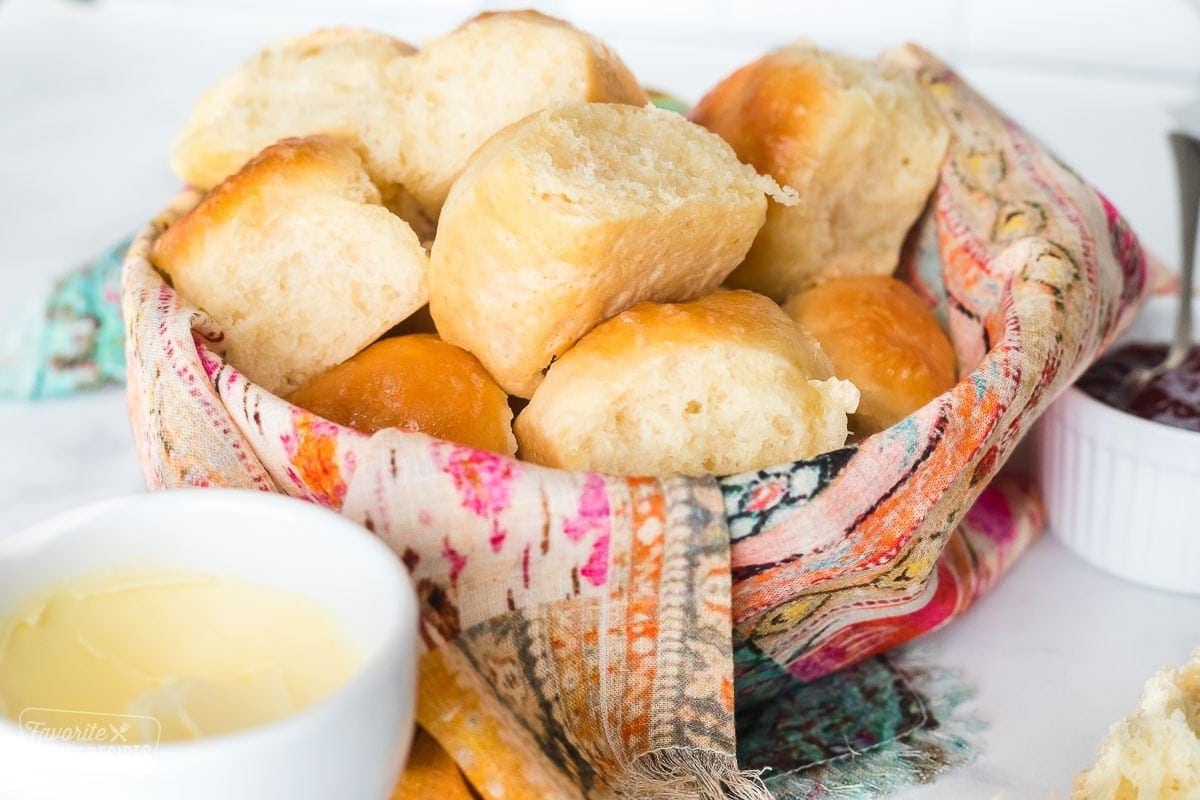 Homemade dinner rolls in a basket.