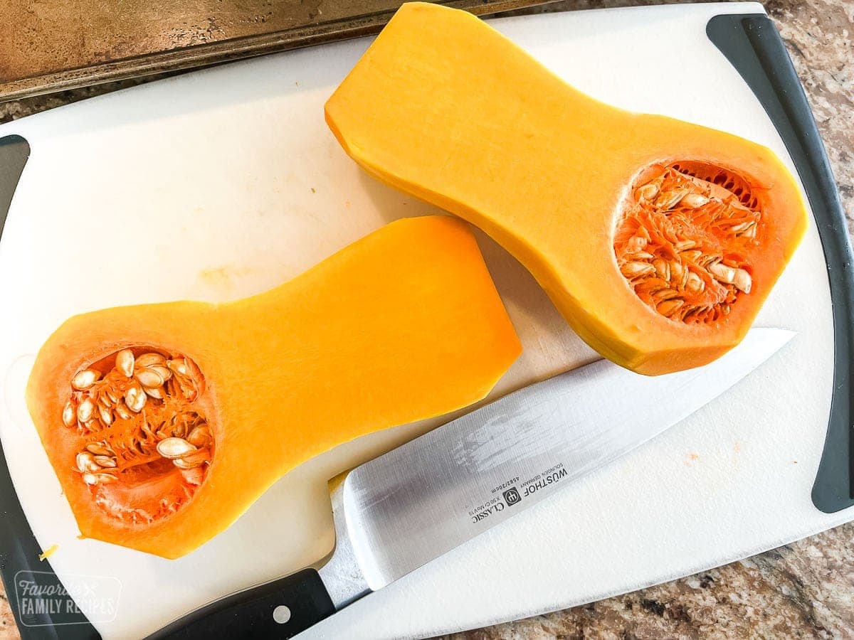 A butternut squash that has been peeled and cut in half
