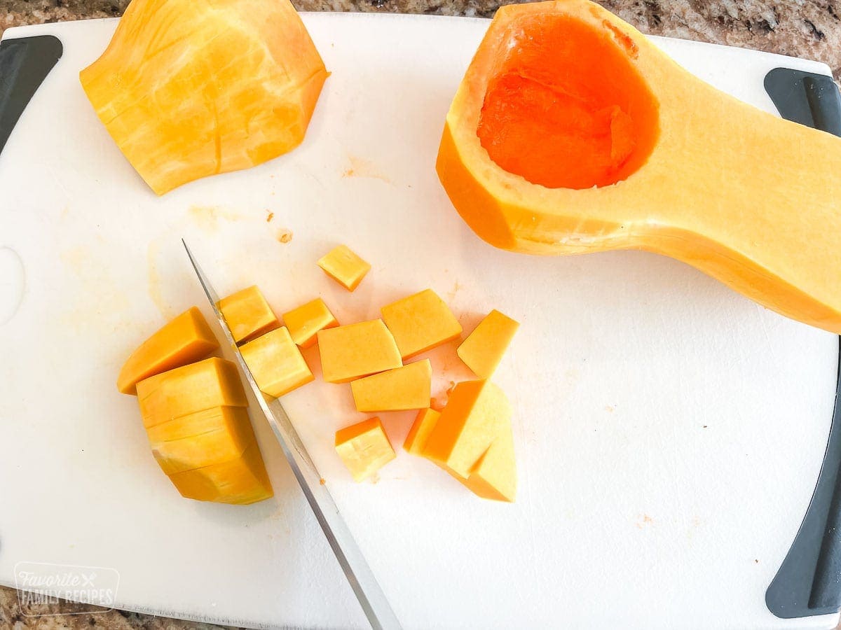 Butternut squash being cut into cubes