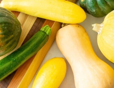 Summer and winter squash varieties including butternut, yellow, pumpkin, zucchini, acorn, and spaghetti squash