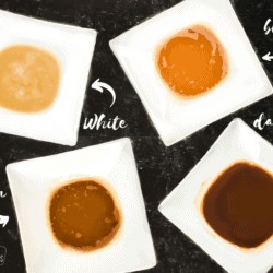 The 4 types of roux including white, blond, brown, and dark in white bowls