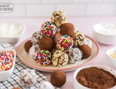 A stack of chocolate truffles on a plate