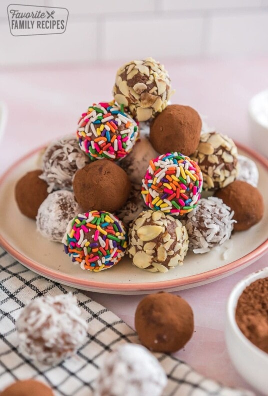 A stack of chocolate truffles on a plate