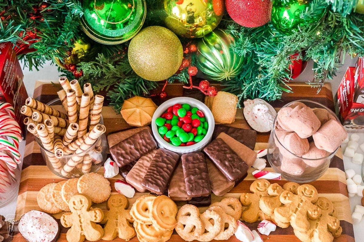 Cookies, Tim Tams, and M&Ms on a hot chocolate charcuterie board