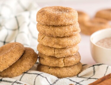 A stack of snickerdoodles on a dishcloth