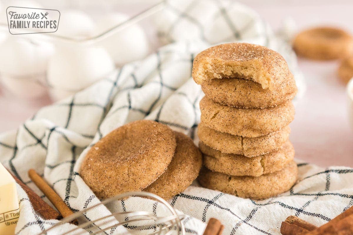 These cinnamon sugar cookies recipe transforms a classic sugar cookie into a tasty Fall treat. Cinnamon sugar cookies are a classic cookie that’s known for its cinnamon and sugar coating. A stack of snickerdoodles on a dishcloth.