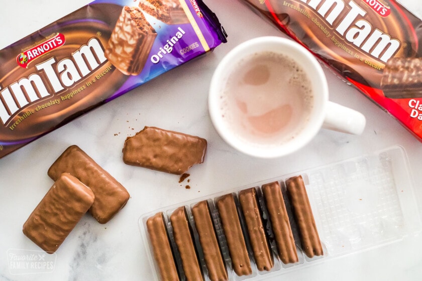 Packages of Tim Tams and a mug of hot chocolate