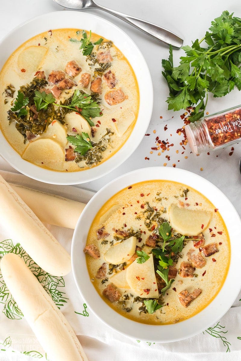 A top view of two bowls of zuppa toscana