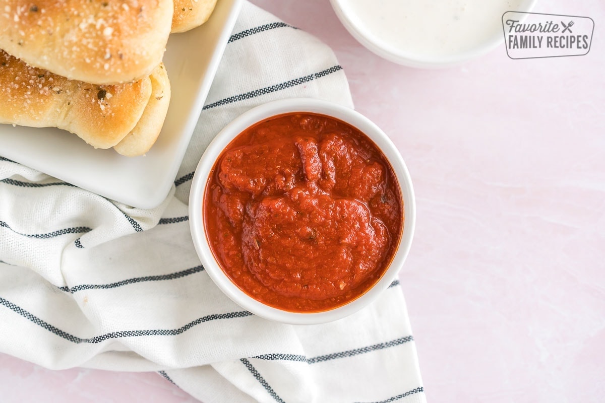 A bowl of marinara sauce. 