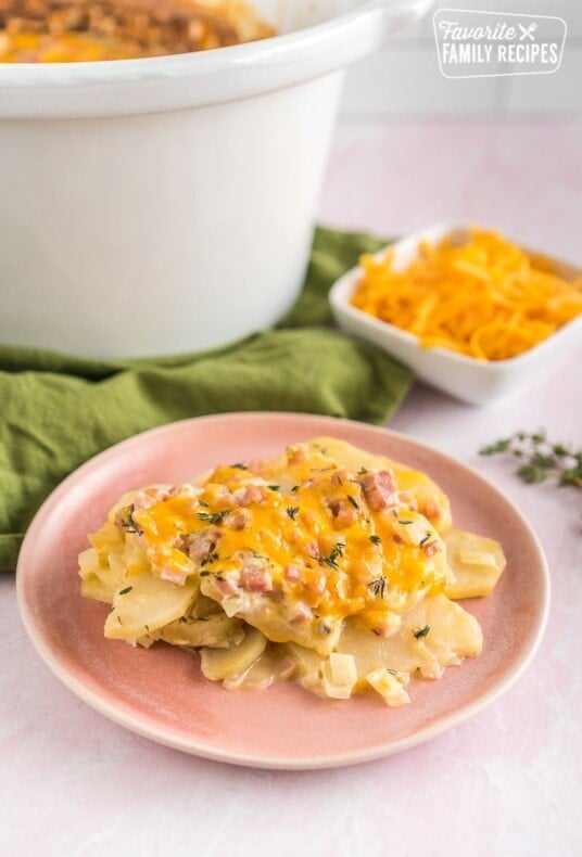 A plate of crock pot scalloped potatoes with ham