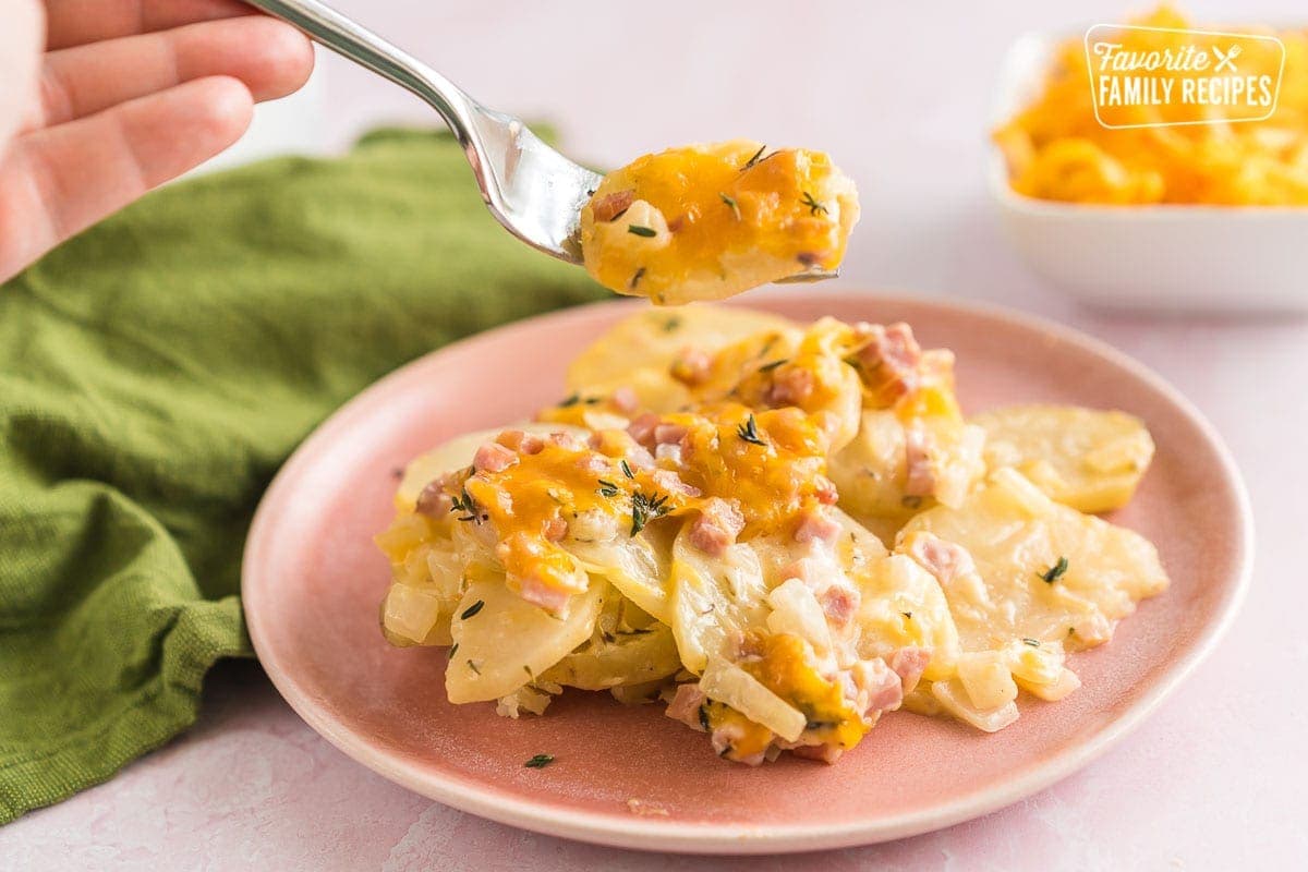 A plate of crock pot scalloped potatoes with ham