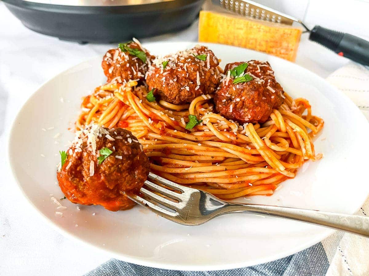 Spaghetti and Instant pot meatballs on a plate.