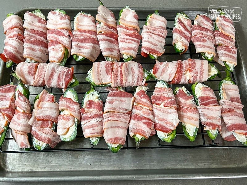 Jalapeños halves with cheese stuffing wrapped in bacon