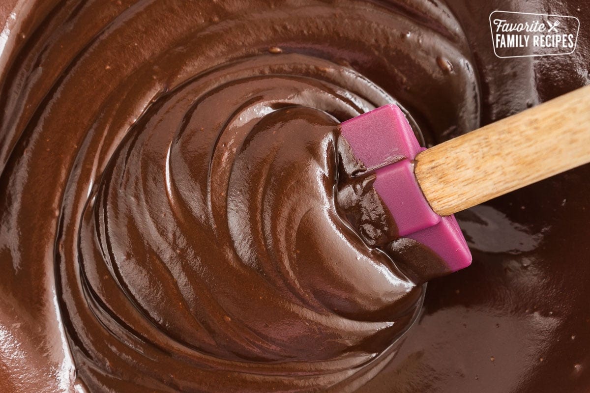 Chocolate fondue being stirred with a spatula