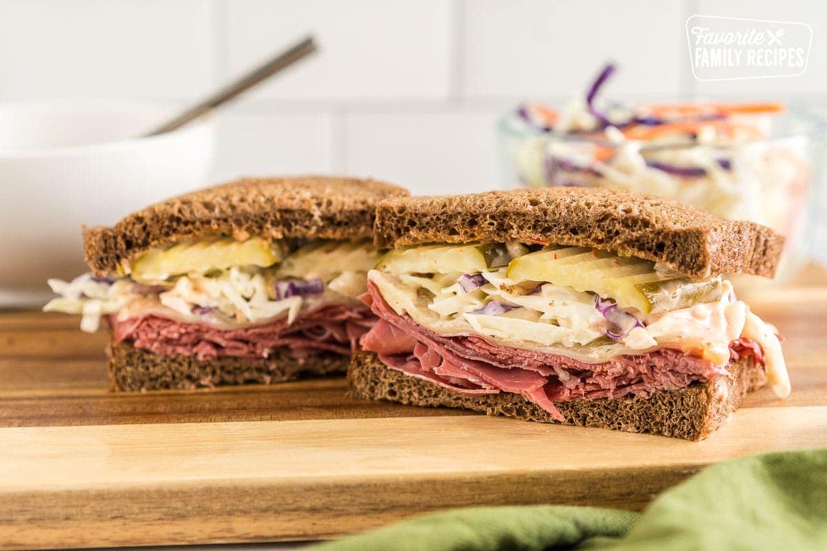 Corned beef sandwich on a wooden board.