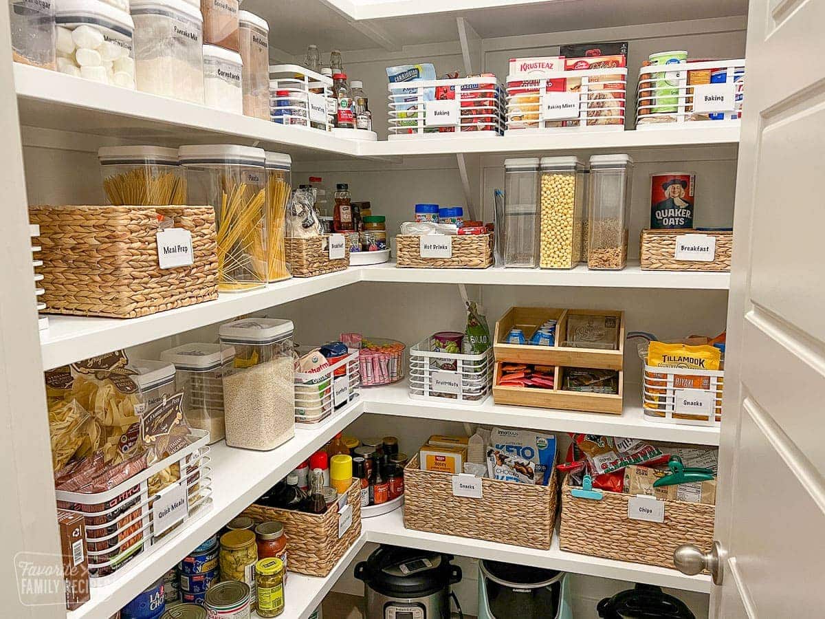 An organized pantry with all items in bins and labeled
