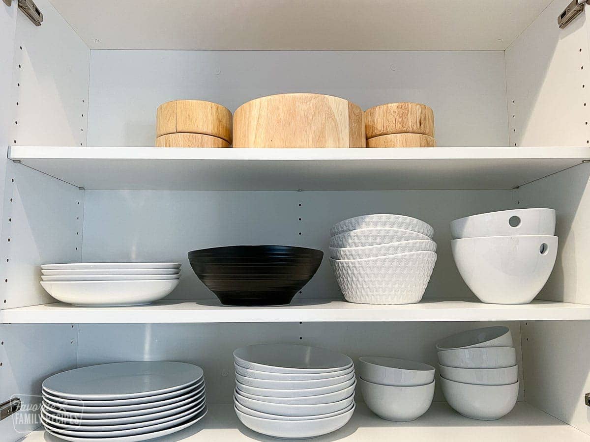 Bowls and plates neatly organized in a cupboard