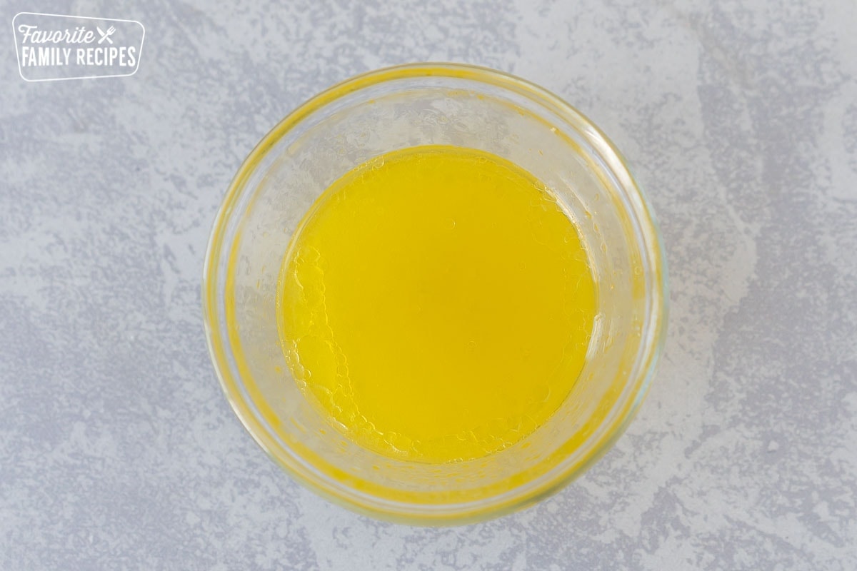 Lemon and olive oil mixed together in a small glass bowl