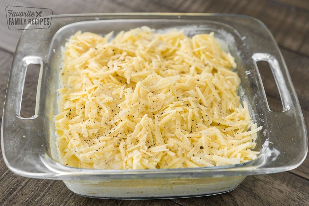 Unbaked Au Gratin potatoes in a baking dish before they go in the oven