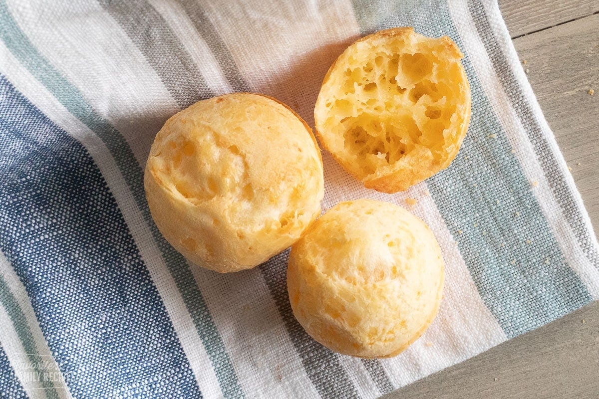 A close up of a Brazilian cheese bread roll, zoomed into show chewy texture