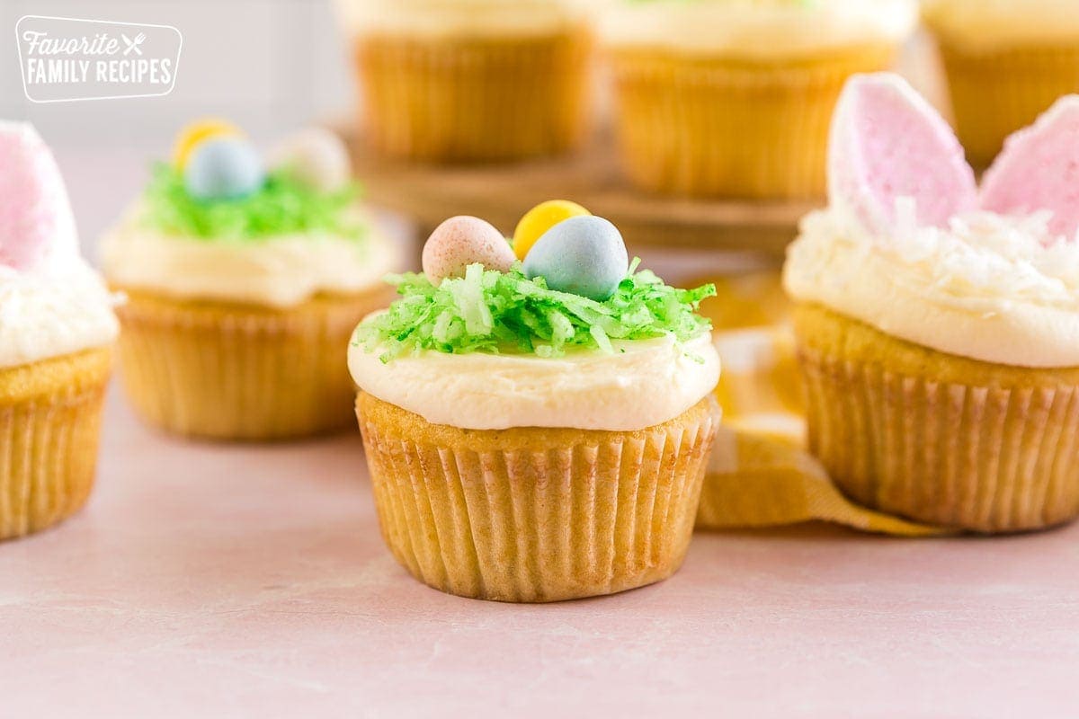 An Easter Cupcake with a coconut birds nest and candy eggs on top