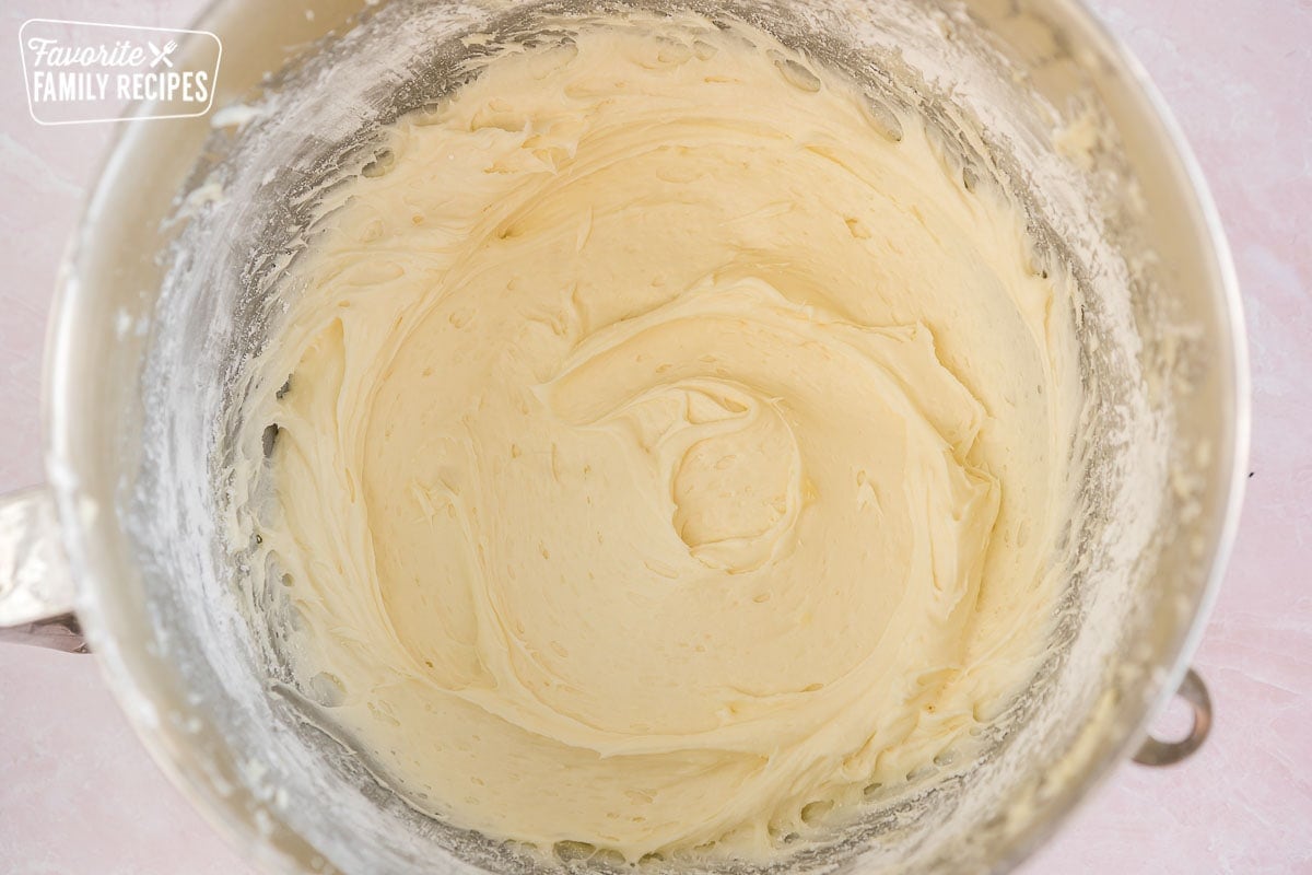 Cream cheese frosting in a large mixing bowl