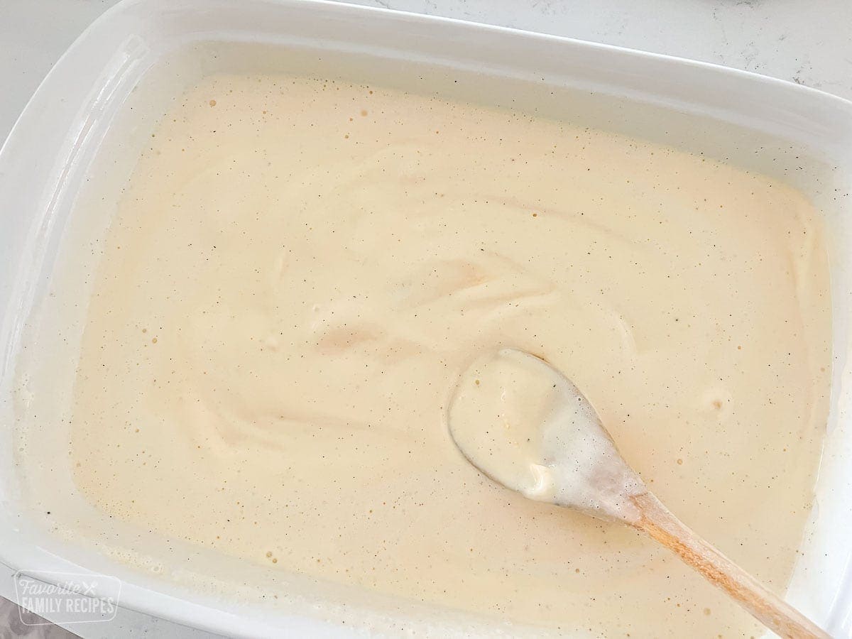 Softened ice cream spread out in a pan to make fried ice cream cake